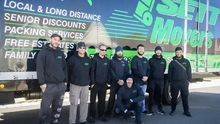 movers in Trenton NJ - SETT Movers crew posing in front of their moving truck